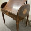 Alternate side view of desk with tambour open and writing pad at extended angle